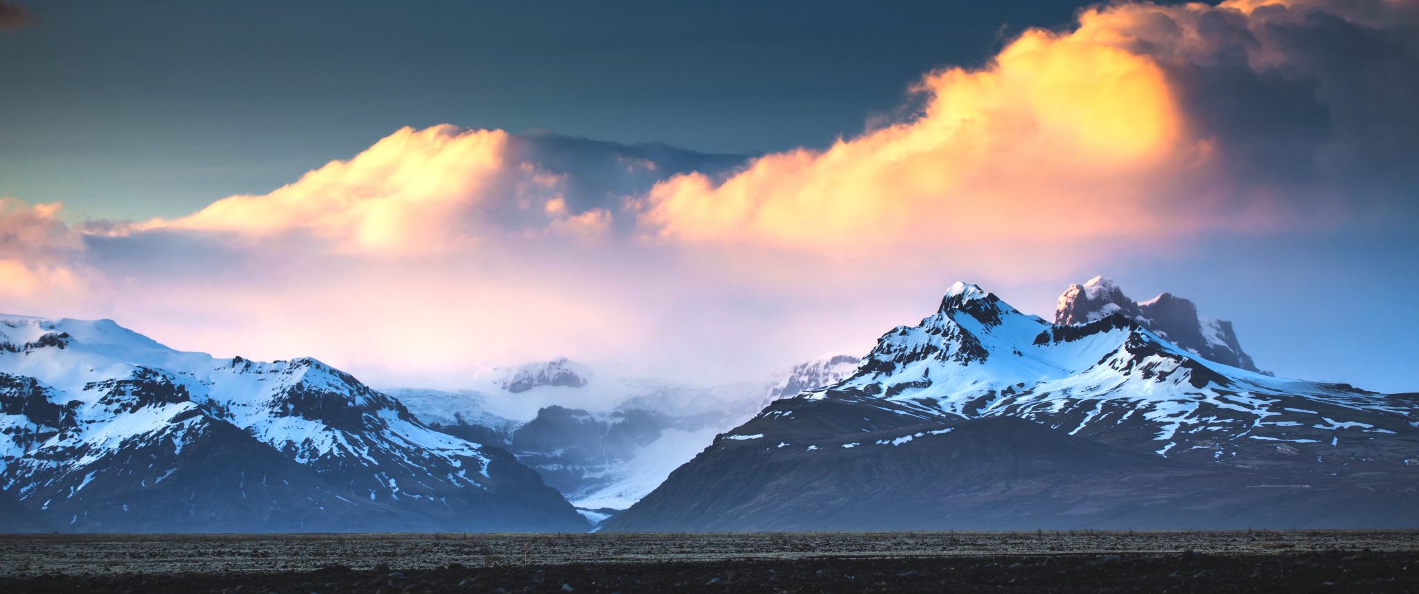 Sunset Panorama of snowy mountains